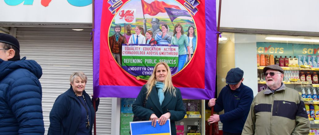 Cynon Valley MP Beth Winter showing solidarity with our banner in Pontypridd